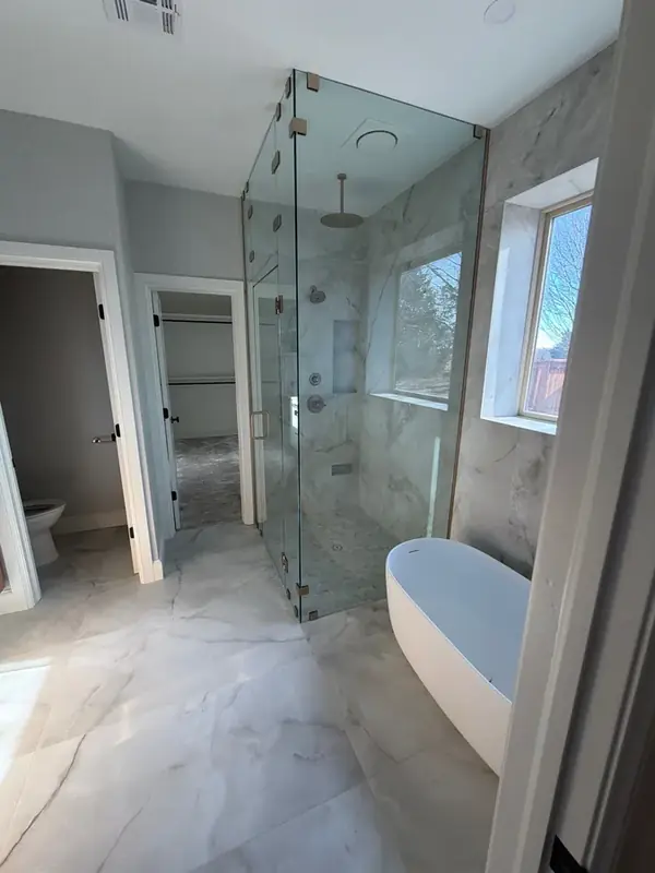 Custom marble bathroom remodel by ScottBuilt